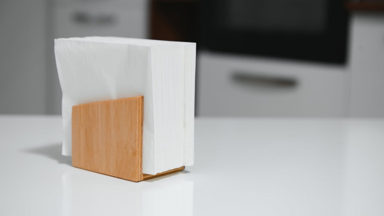 Wooden napkin holder in kitchen.