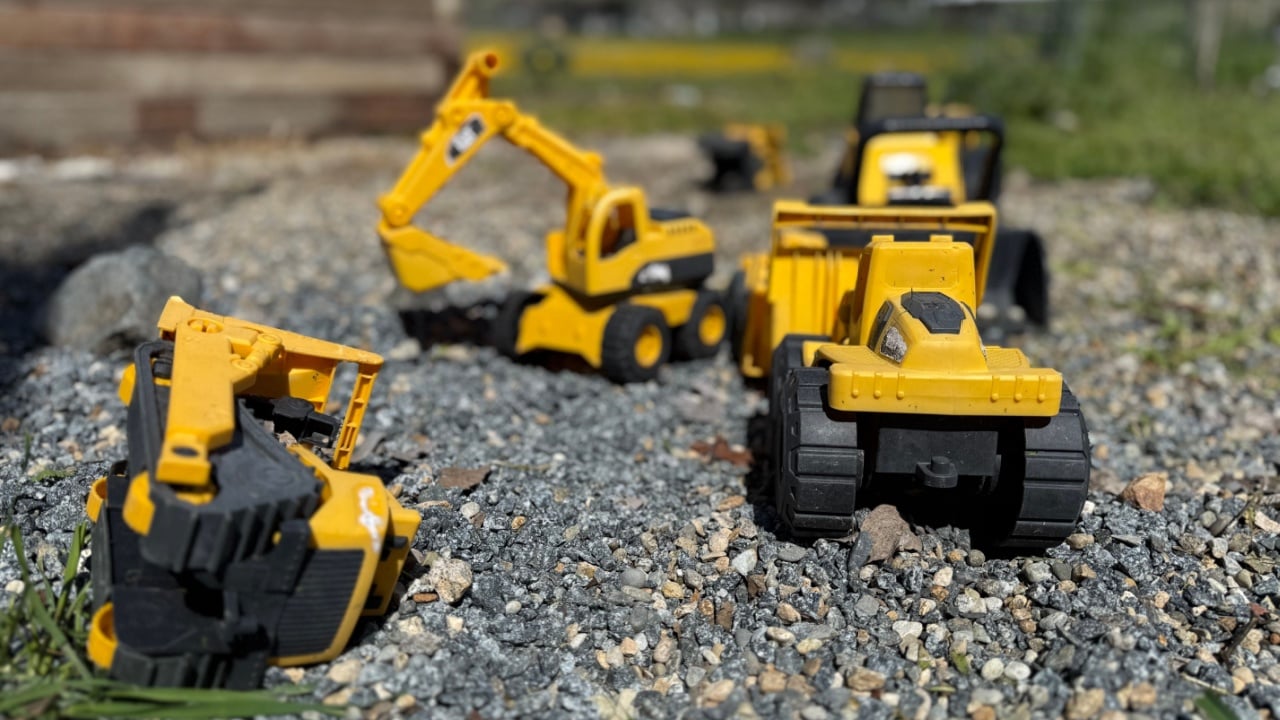 Child&rsquo;s Tonka Trucks in Rock Gravel outside 