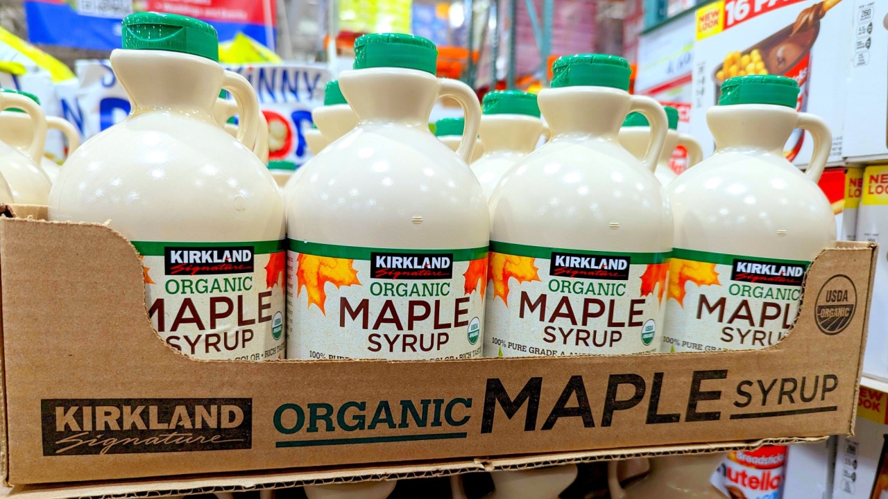 Apex, North Carolina - May 1 2025: Kirkland Signature Organic Pure Maple Syrup Bottles on Shelf at Costco