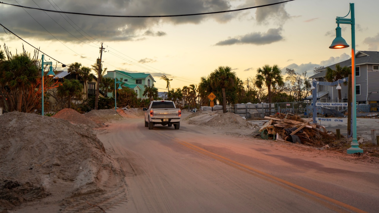 Cleanup efforts after hurricane in Florida. Piles of debris and construction waste on streets of Manasota Key, severe impact on local homes and infrastructure. Englewood, USA - October 22, 2024.