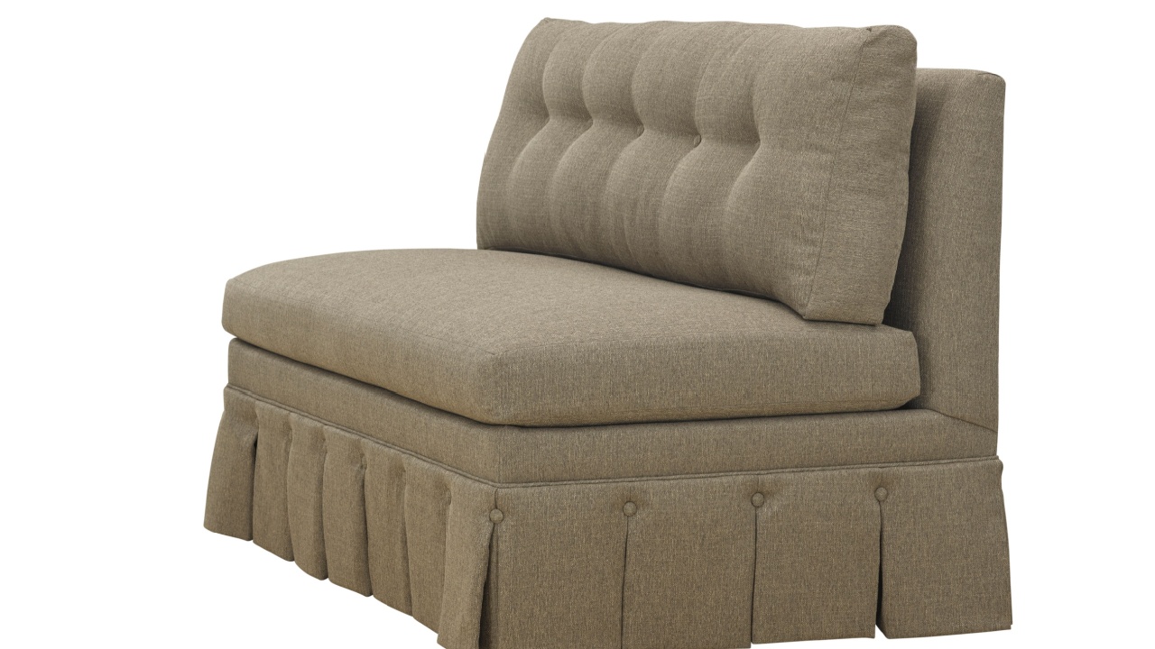 Elegant single armchair with tufted back and skirt detail on white background clipping path. Furniture, interior object.