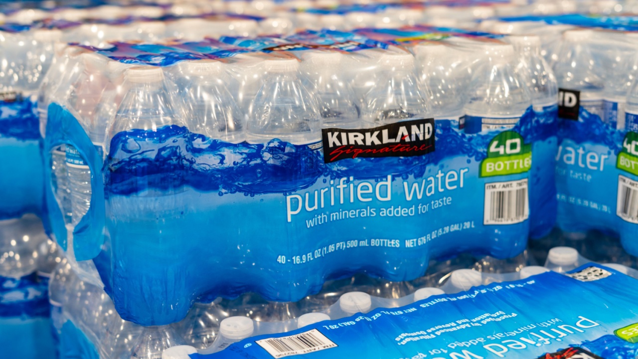 Raleigh, North Carolina - November 6 2025: Kirkland Signature Purified Water Bottles Large Case Display Stacked on Retail Shelf at Warehouse Store