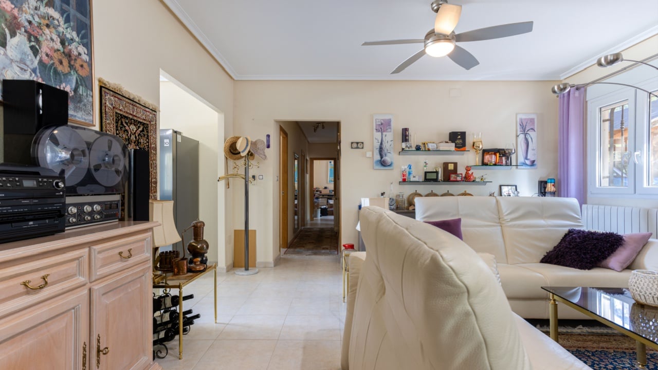 Torrevieja Spain 24 September 2025: Cluttered living room with ceiling fan and light