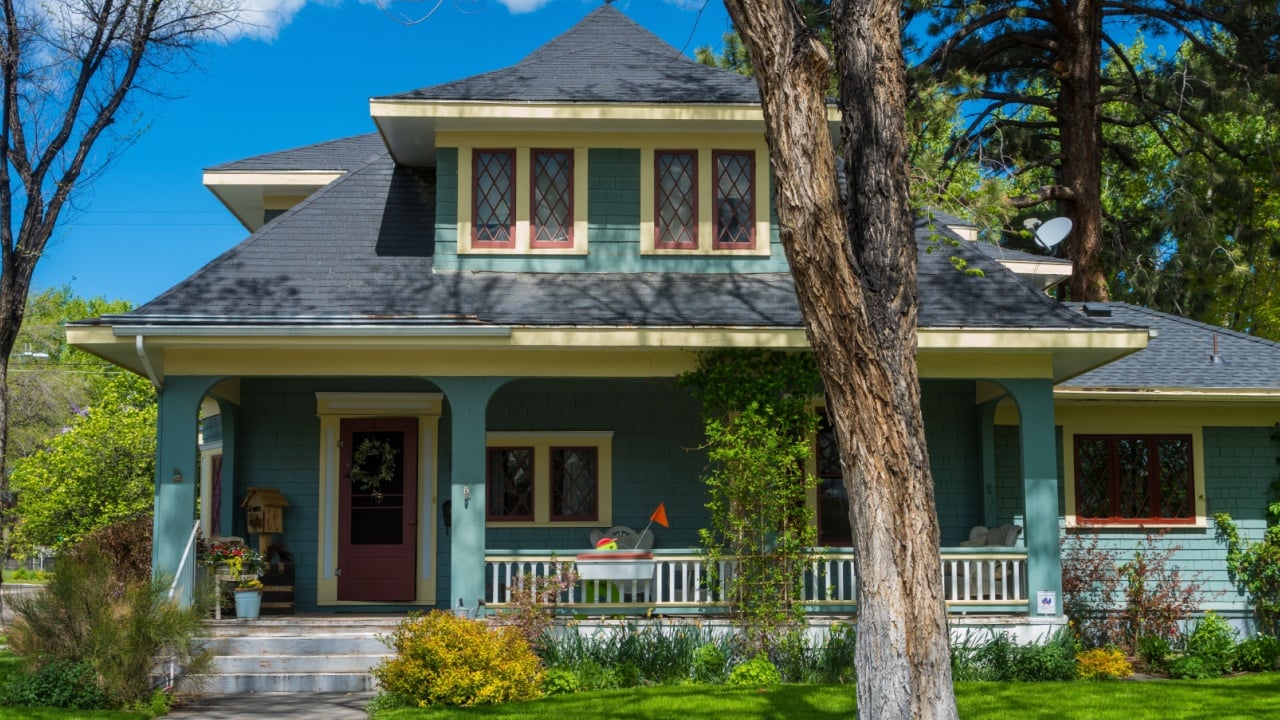 Well-kept older classic vintage American house with porch