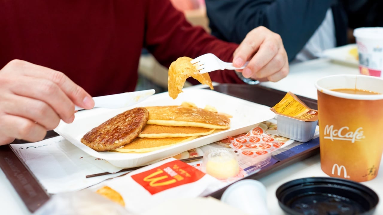 HONG KONG - CIRCA NOVEMBER, 2016: a man eat breakfast at a McDonald's restaurant in Hong Kong. McDonald's, or simply McD, is an American hamburger and fast food restaurant chain.