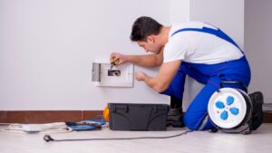 Man doing electrical repairs at home
