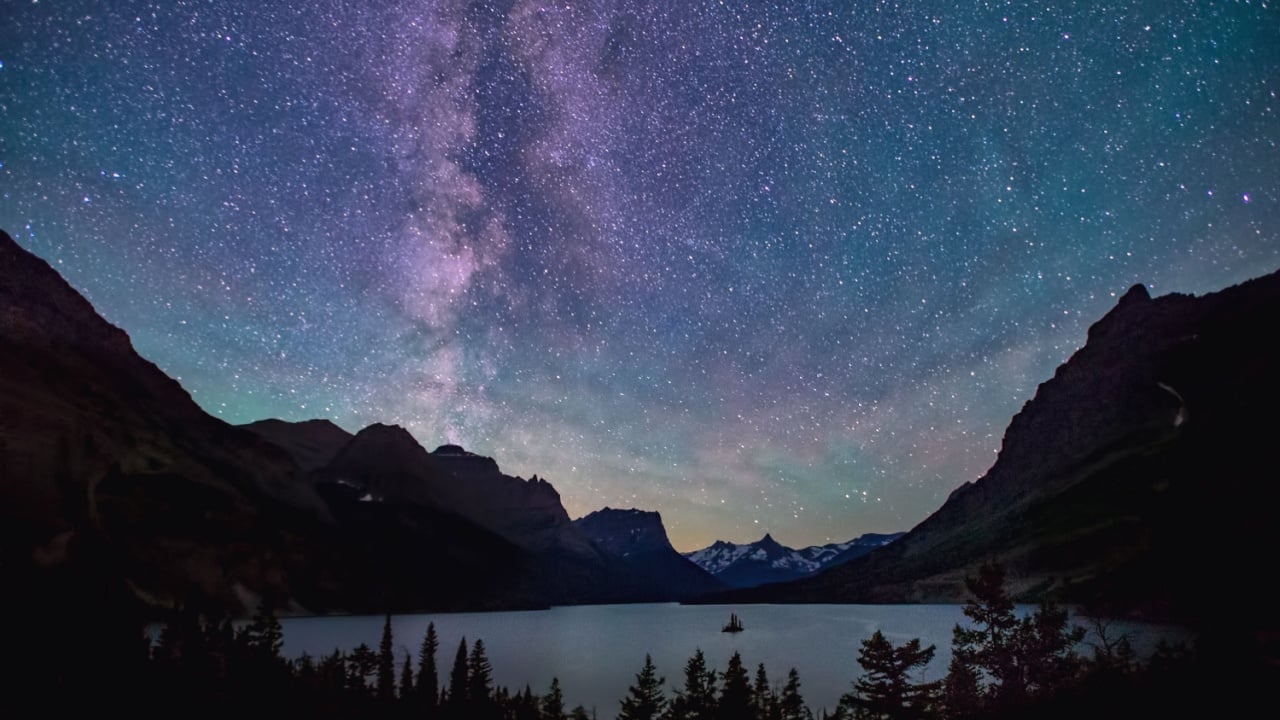 milky way above saint mary lake in glacier national park, montana, on summer night