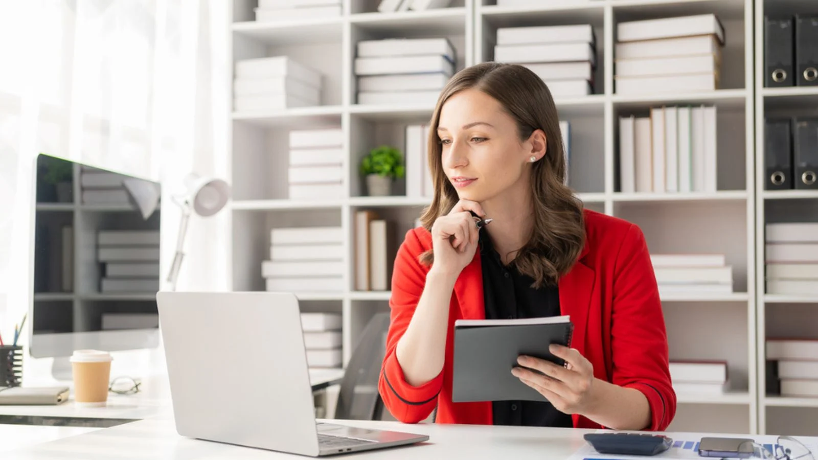 Successful businesswoman smiling happily working on laptop computer video conferencing online zoom accounting accounting finance corporate tax