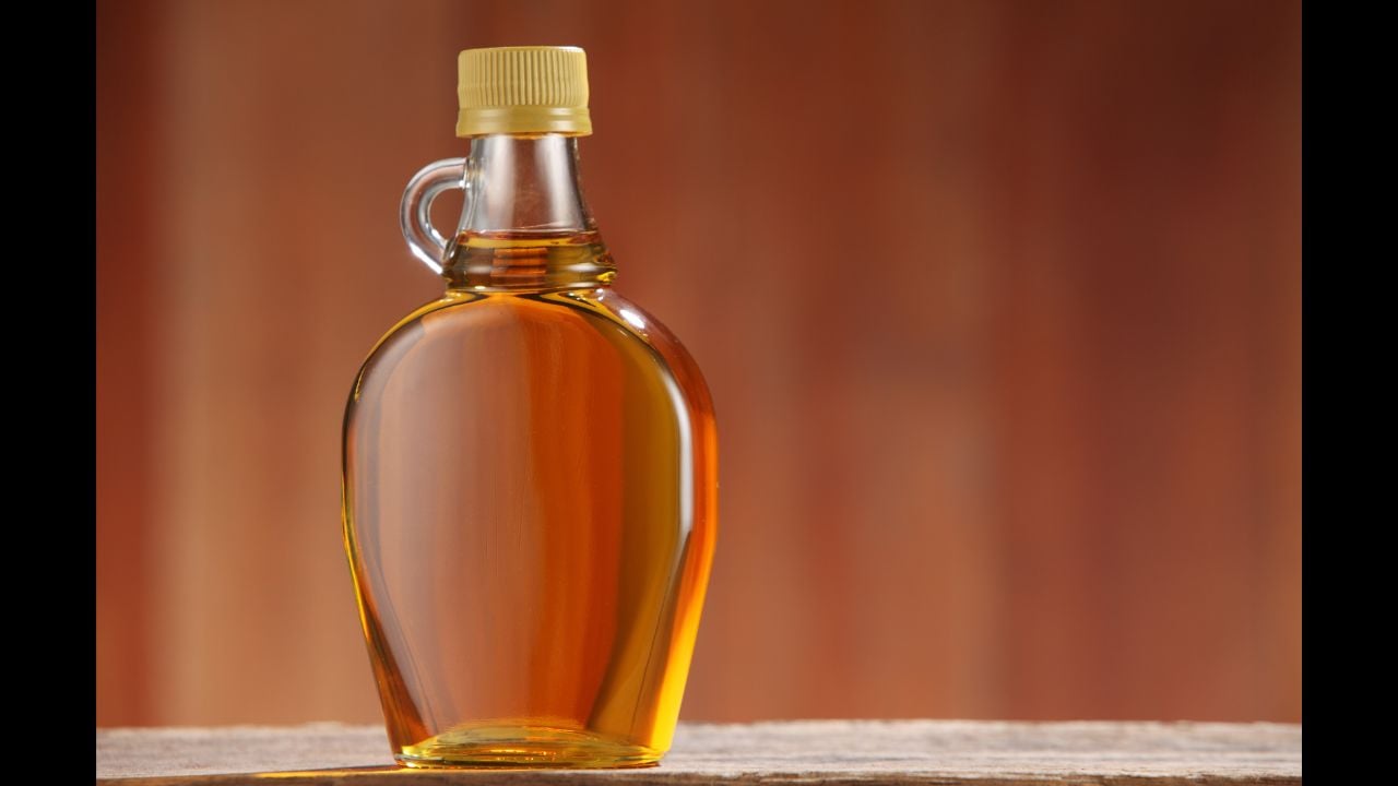 bottle of agave syrup on the wooden background