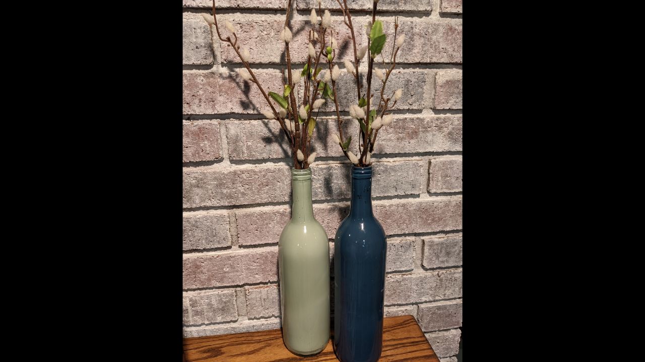 Repurposed wine bottles painted as vases