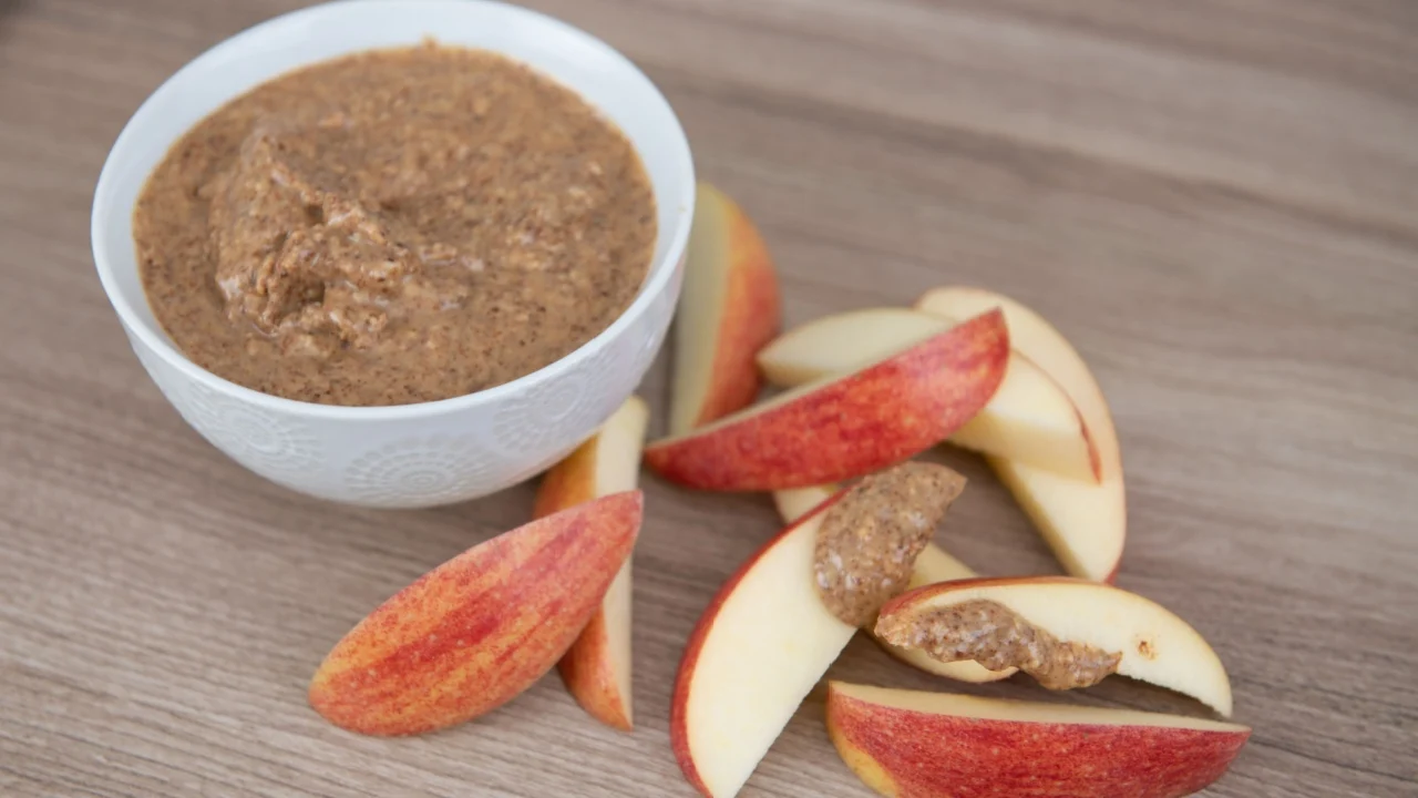 Almond Butter in Small White Bowl and Apple Slices for Snacking