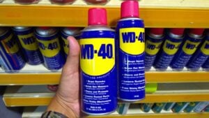KUALA LUMPUR, MALAYSIA - MARCH 29, 2019: Hand hold WD-40. WD-40 is the trademark name of the penetrating oil and water-displacing spray is now available in Malaysia hardware stores.