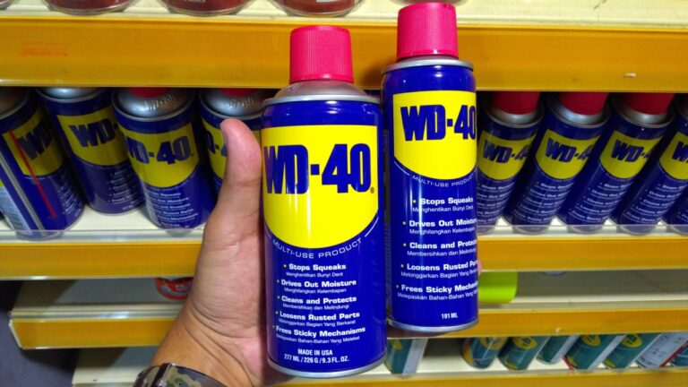 KUALA LUMPUR, MALAYSIA - MARCH 29, 2019: Hand hold WD-40. WD-40 is the trademark name of the penetrating oil and water-displacing spray is now available in Malaysia hardware stores.