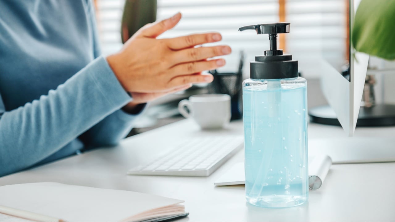 Woman hands using alcohol gel clean wash hand sanitizer anti virus bacteria and working from home
