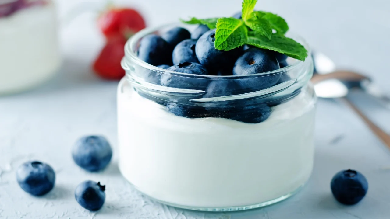 Greek yogurt blueberry parfaits with fresh berries. toning. selective focus