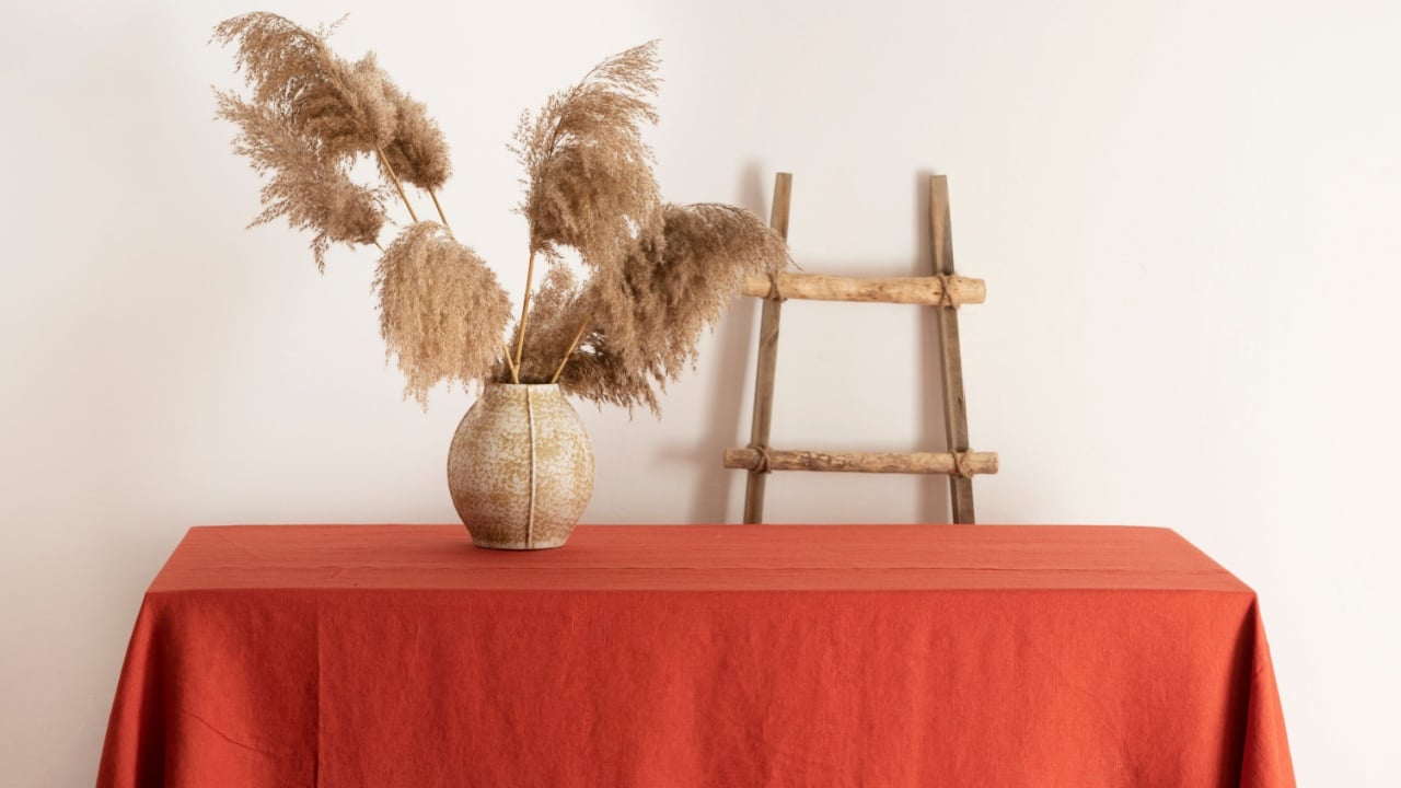 Home decor concept, table with terracotta tablecloth linen