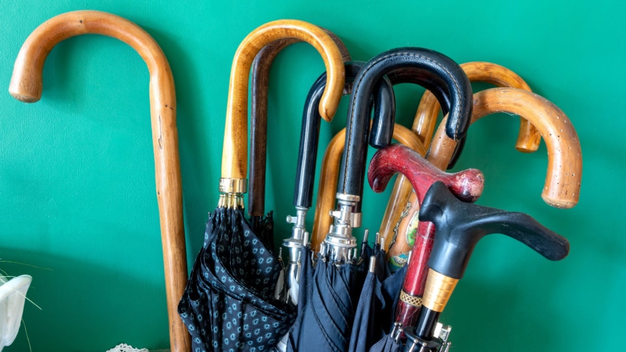 Many different handles of umbrellas.