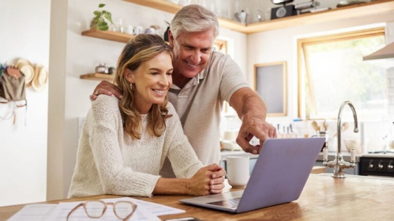 Happy pension couple with laptop and paperwork for retirement planning, online ecommerce website or digital bank application investment. Elderly, senior people for life insurance or asset management