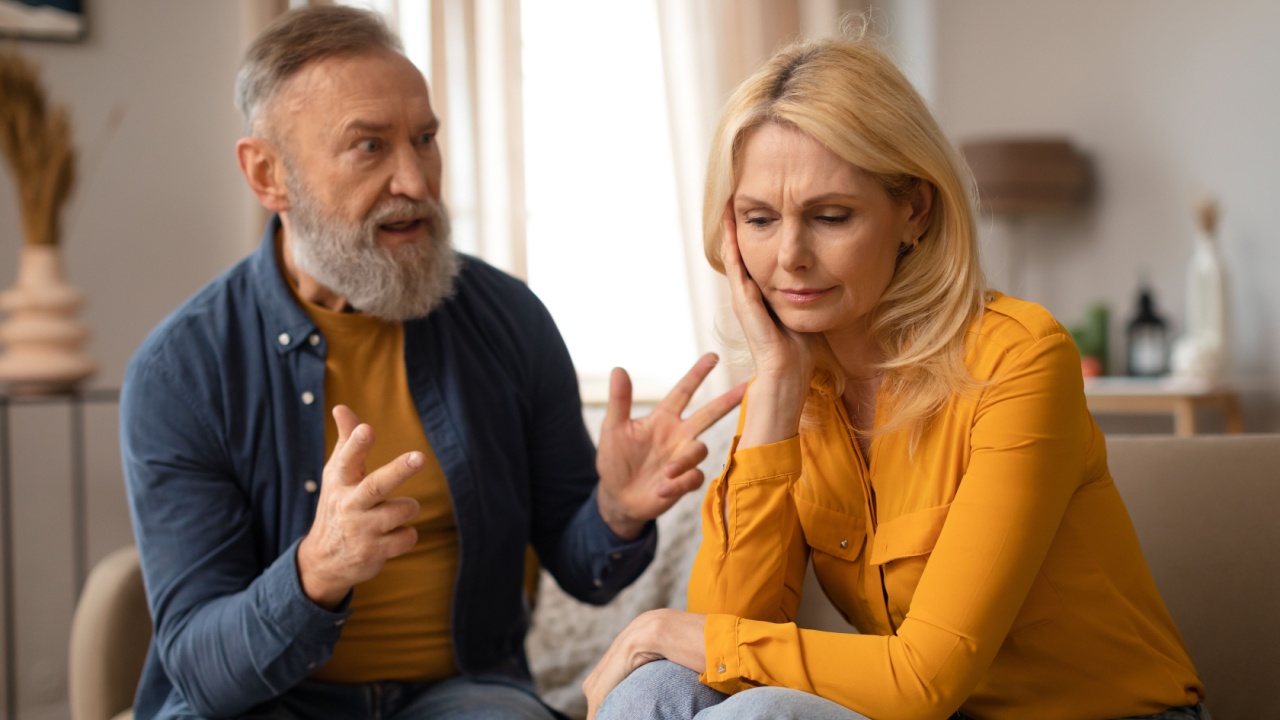 Unhappiness In Marriage. Senior Couple Having Quarrel, Husband Shouting At Upset Wife, Experiencing Tense Moments In Relationship Sitting At Home. Domestic Abuse And Conflicts. Selective Focus