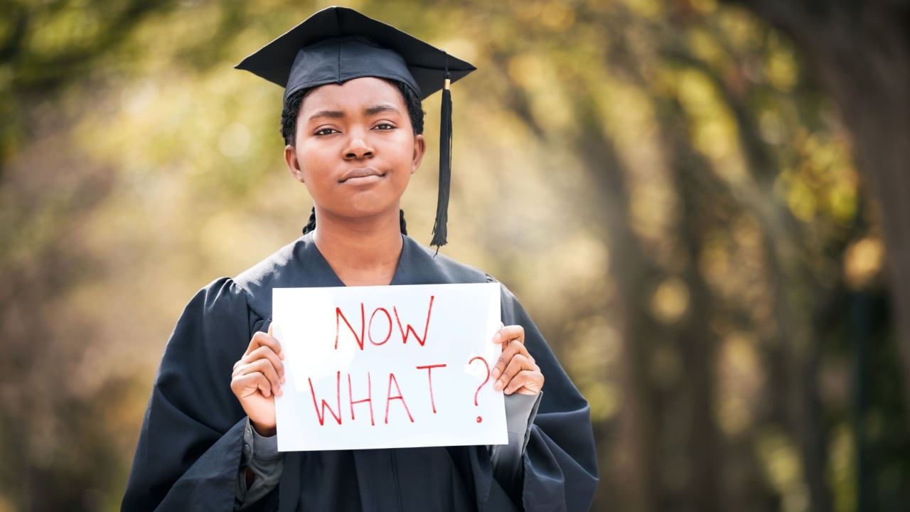 Portrait, graduation or poster with a black woman in doubt as a student at a university event. Confused, question and a female college graduate standing on campus asking what now after scholarship