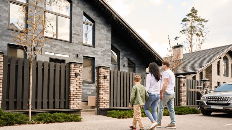 Young caucasian family goes to a new house