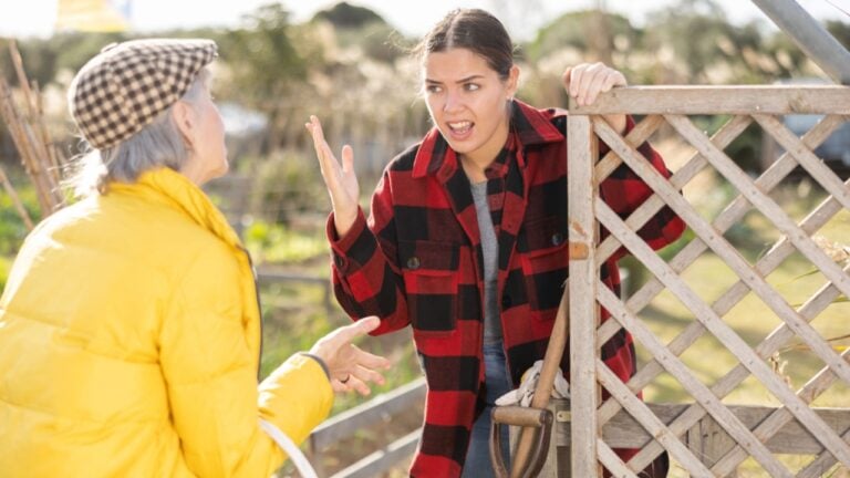 Farm neighbors quarrel over farm backyard in autumn day