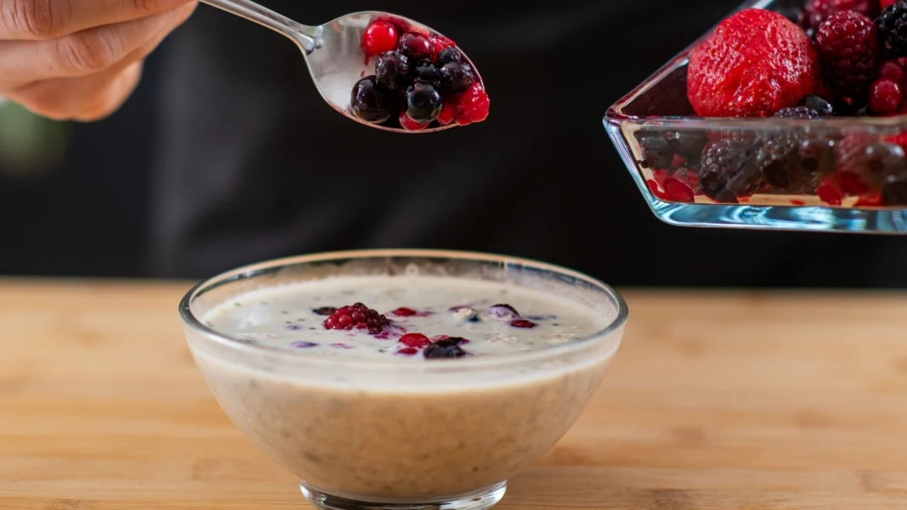 Superfood oatmeal, combining wholesome oats, creamy soy milk, and a medley of luscious berries for a vibrant and nutritious breakfast.