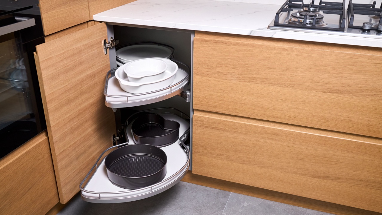 Kitchen access mechanism Magic corner for Blind Corner Cabinets. Solution for a kitchen corner storage in cupboard. Corner unit with pull out shelves for cookware.