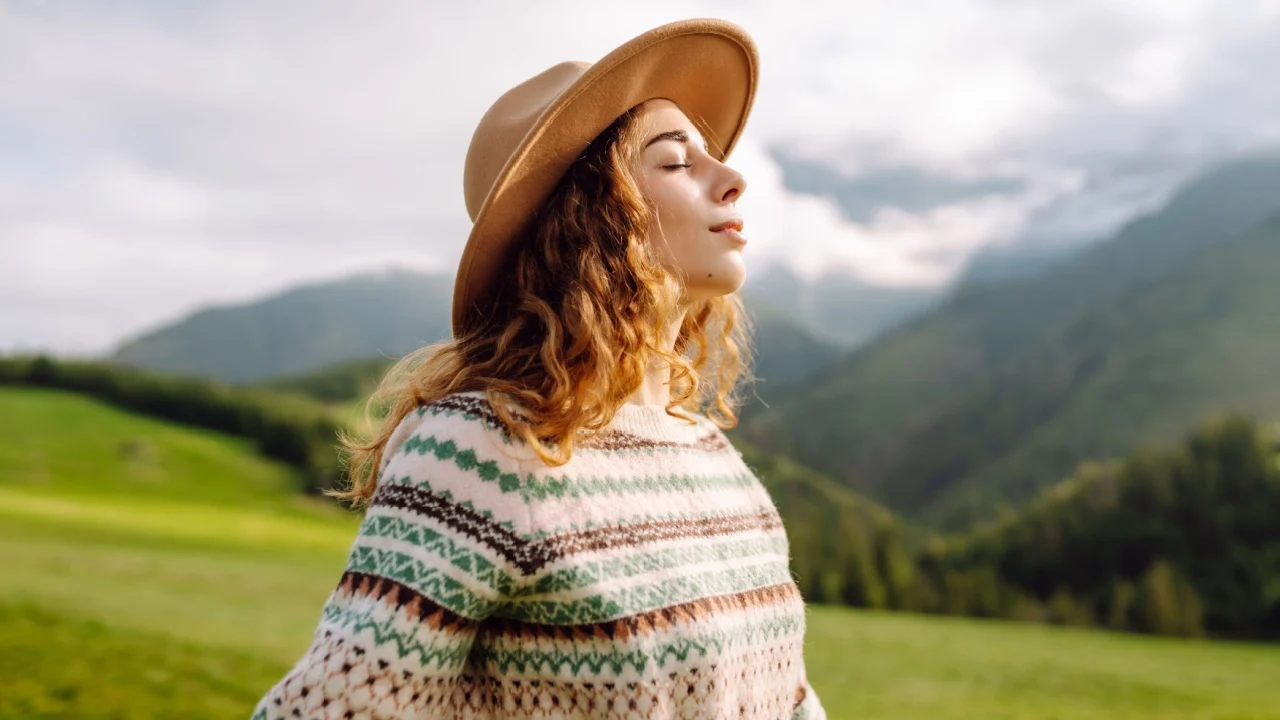 Happy Woman tourist admiring the landscape mountains nature. Travel, nature concept.