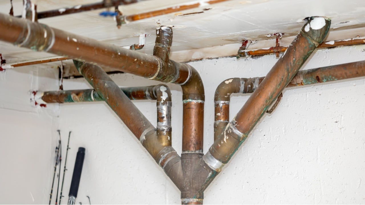Complex network of old piping on a building's ceiling