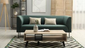 Comfortable sofa, coffee table and folding screen in stylish living room. Interior design