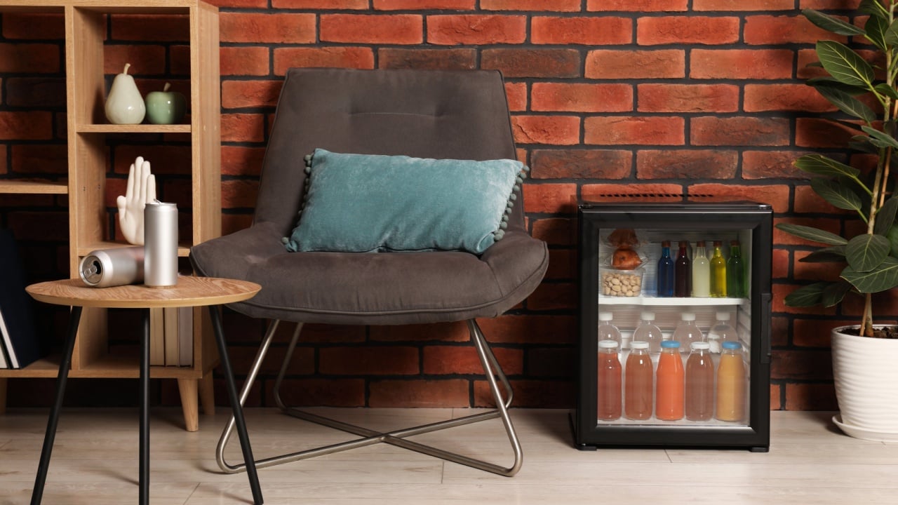 Mini refrigerator with drinks and snacks indoors