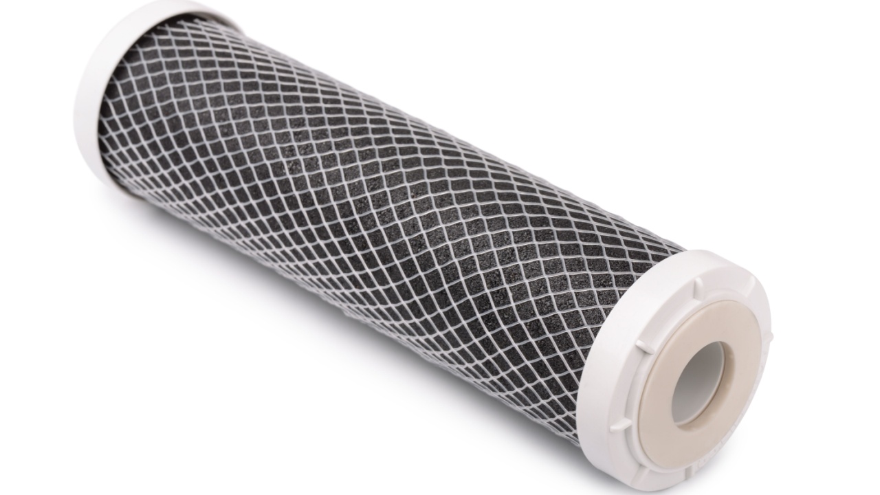Carbon water filter cartridge isolated on white