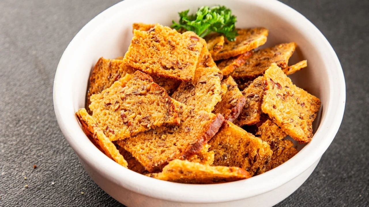 Croutons spices flax seeds croutons crisps rye bread tasty snack fresh delicious gourmet food background on the table rustic food.