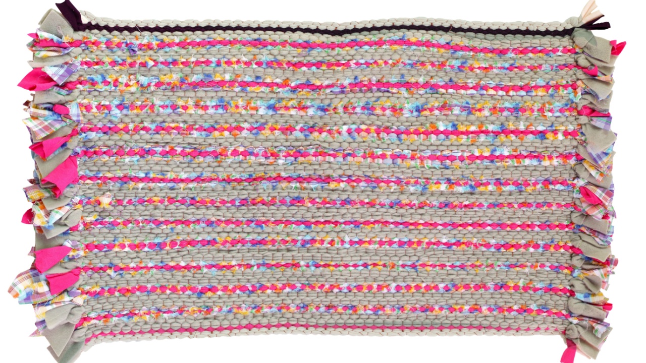 Colorful knitted cloth reuse Closeup of crochet rag rug isolated on white background. This has clipping path.
