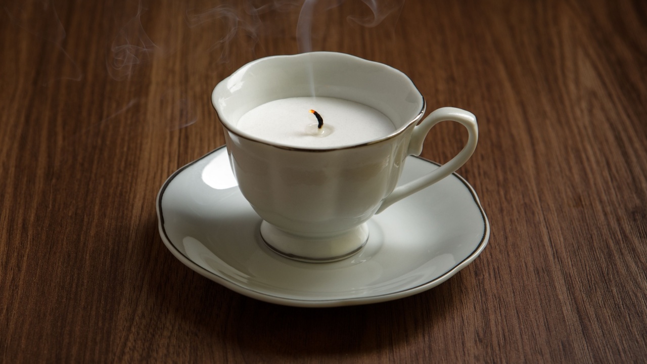 still life image of a candle made in teacups