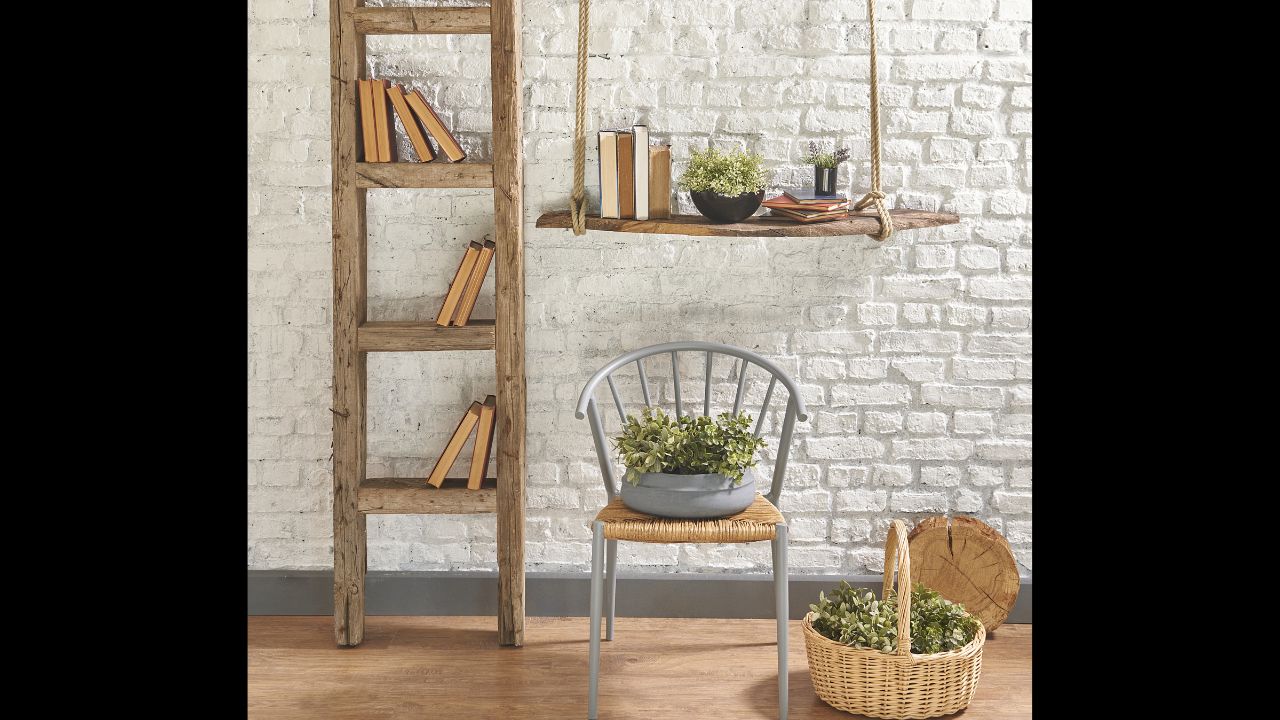 brick wall stairs interior with gray chair