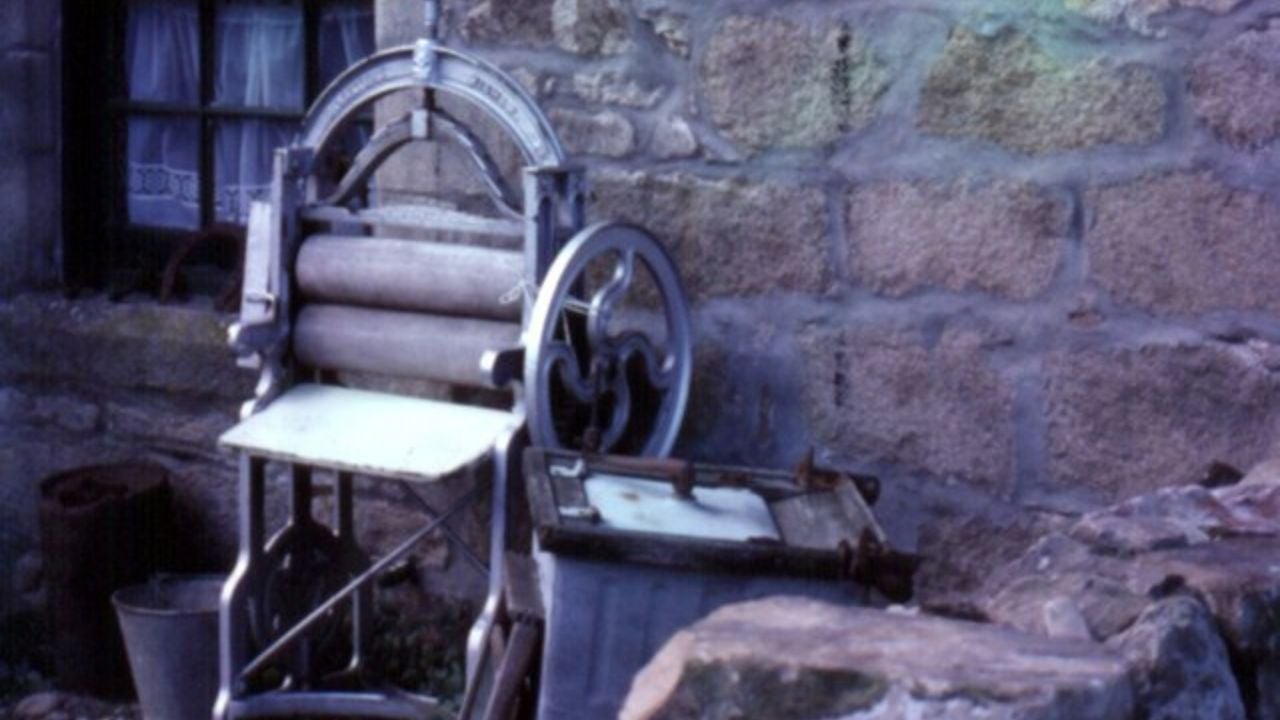 Pitmedden House museum Early hand-operated washing machine, and clothes wringer.