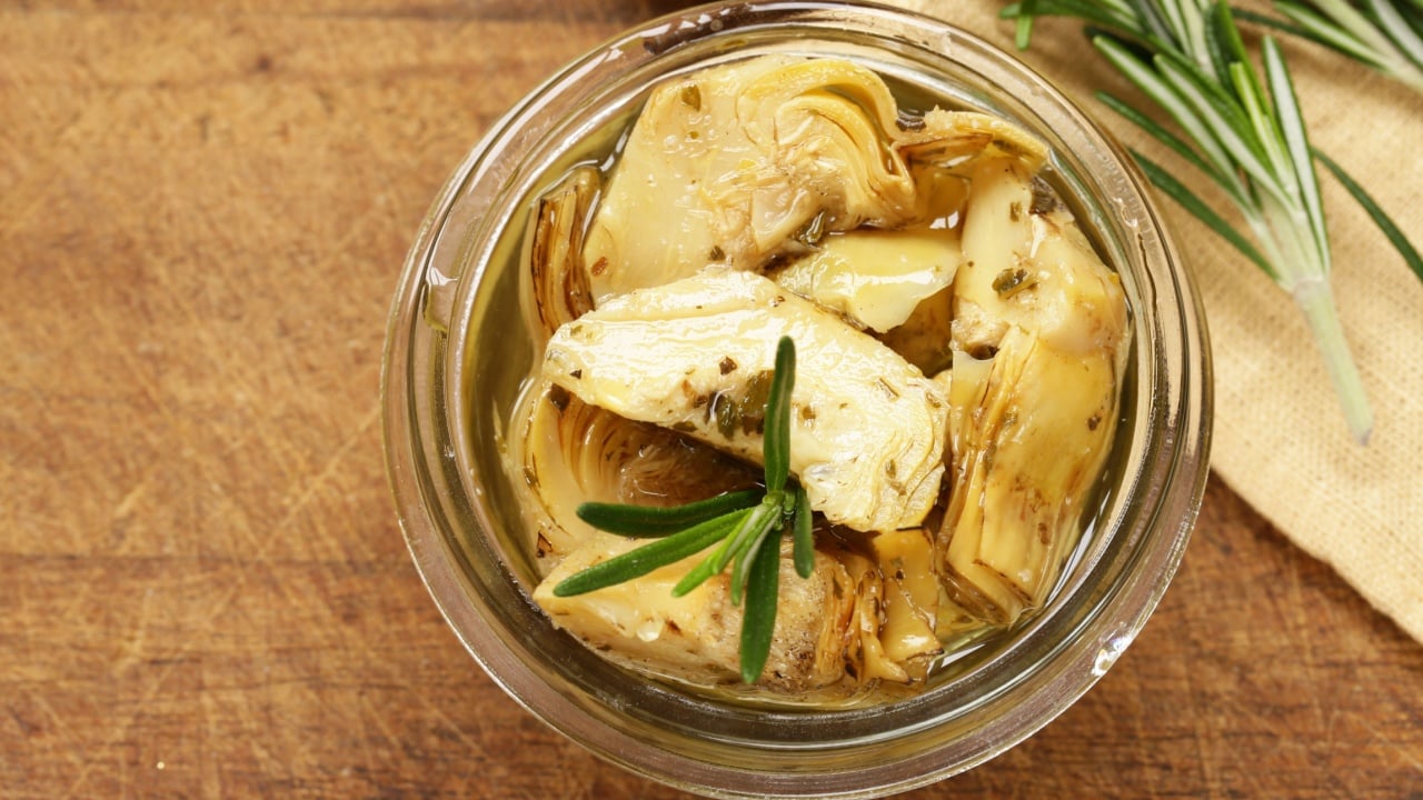 Preserved grill artichokes in oil with spices and herbs