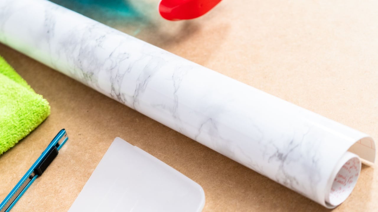Making marble board with adhesive paper for food photography.