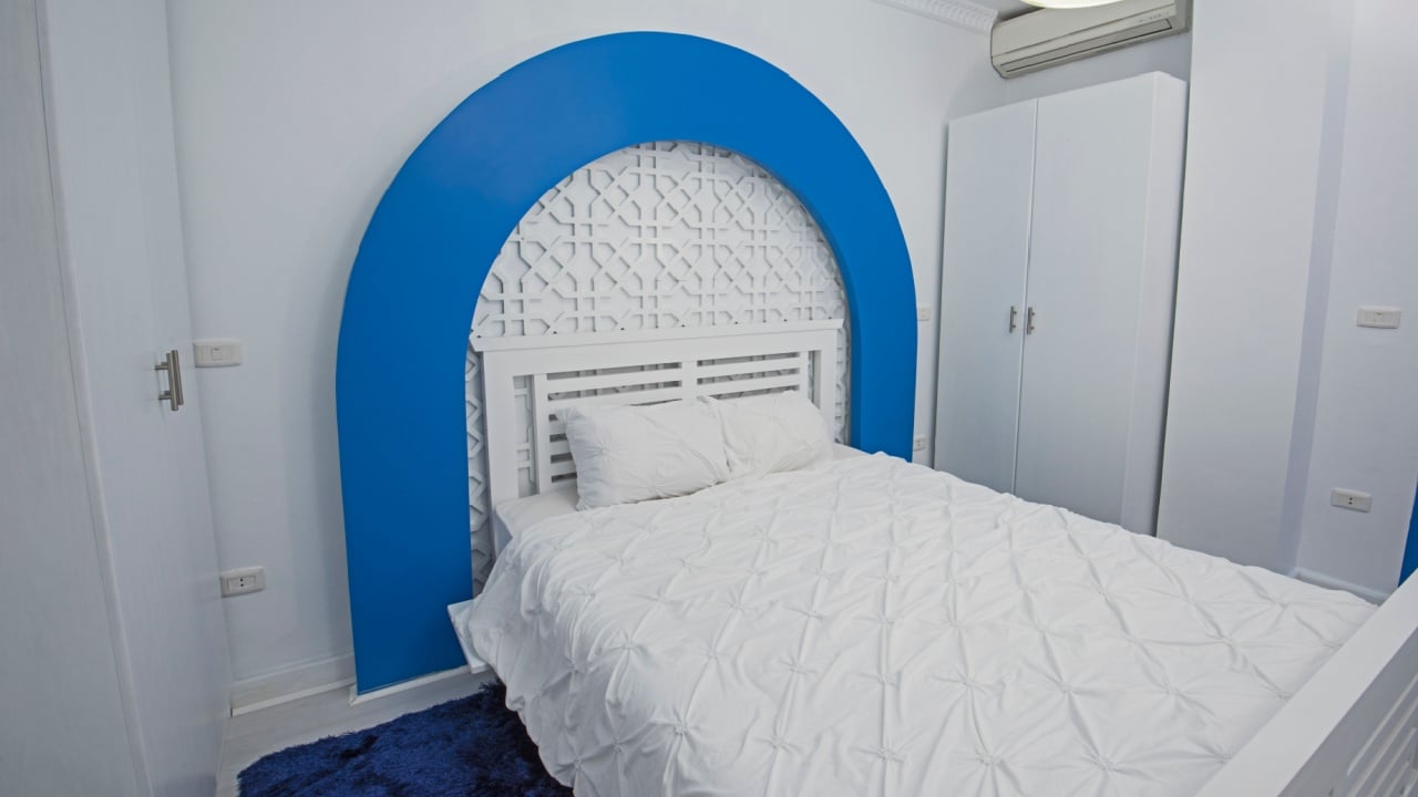Interior design decor furnishing of luxury show home bedroom showing furniture and double bed