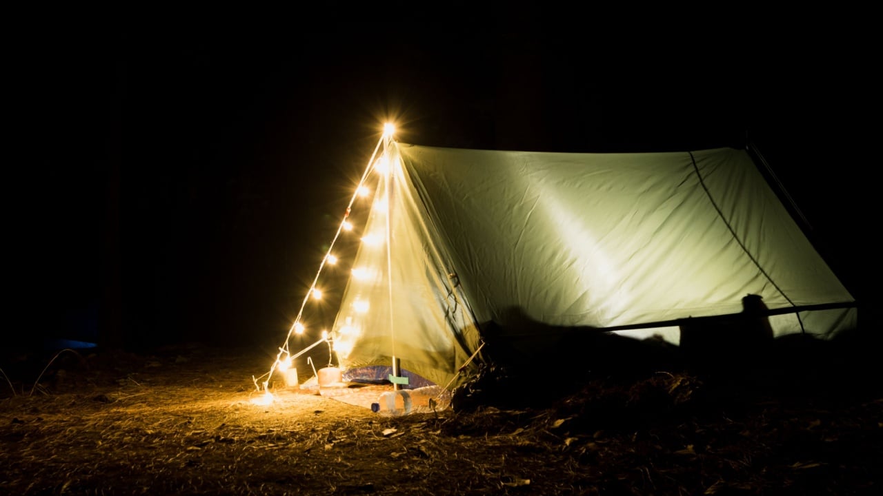 Camping for the night at nature park with light and accessories.