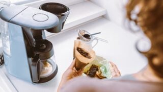 Close-up, different angles, young woman throws away coffee grounds, from coffee machine, into container with food waste, in home kitchen. Waste sorting at home, recycling, composting