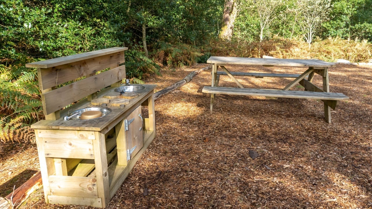 Children outdoor mud kitchen in a forest in County Donegal - Ireland