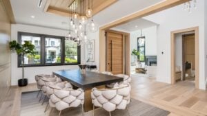 OXNARD, US - Apr 13, 2022: A modern interior featuring a stylish dining room with a wooden table and four chairs set up for a meal