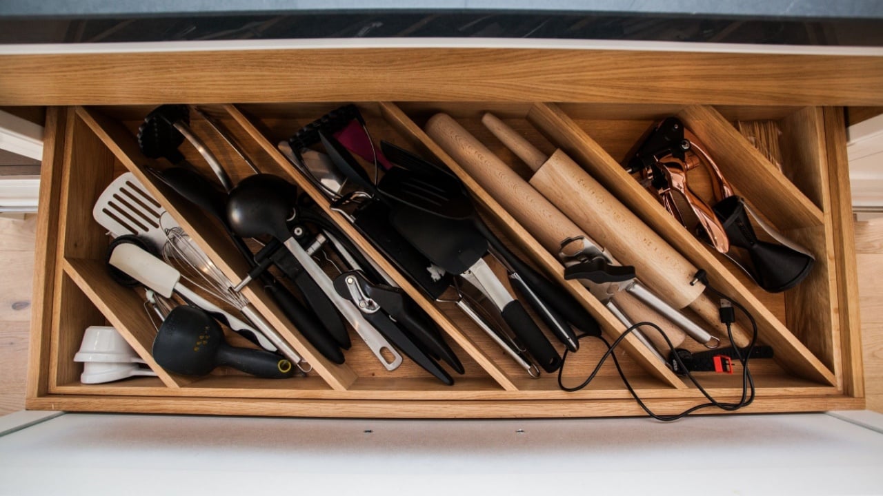 Kitchen storage with drawers and storage for food with light system in a contemporary kitchen design