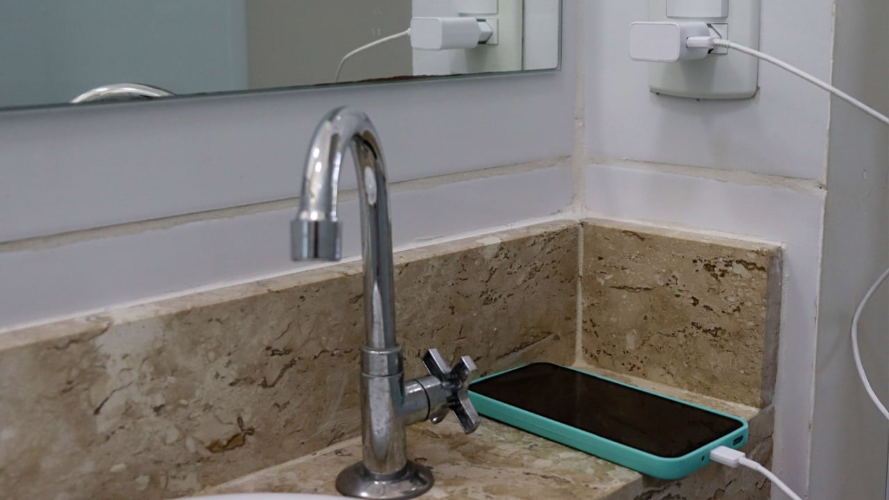 Smartphone charging in the bathroom.