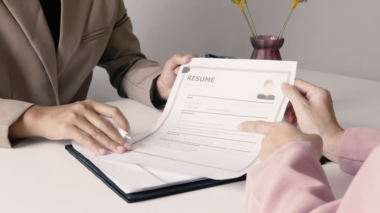 New employees are submitting their documents and resume to apply for a job at a new company. They explain their personal information to their supervisor.