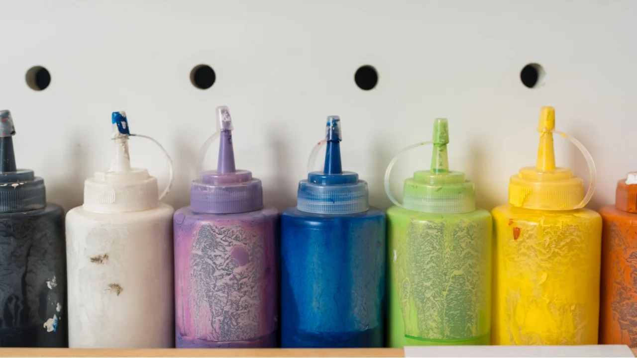 Paint bottles to be squeezed for art and craft education background