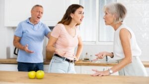 The daughter arguing with nervous old mature mother